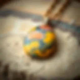 A close-up of a Bumble Bee Jasper pendant showcasing its vibrant yellow, black, and orange hues.