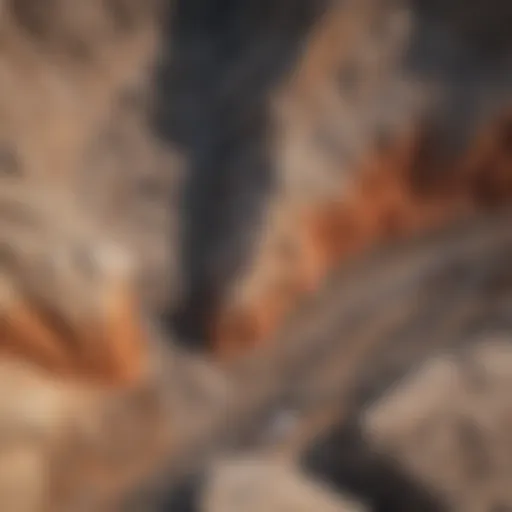 Aerial view of a rock mining site showcasing geological layers