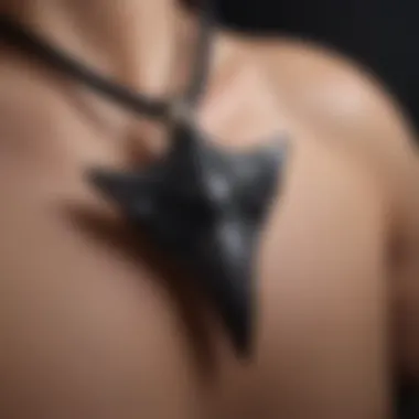 Intricate Craftsmanship of Black Shark Tooth Necklace Close-up view of a black shark tooth necklace showcasing intricate craftsmanship.
