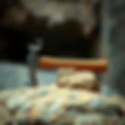 A detailed view of a geological hammer resting on a rock.